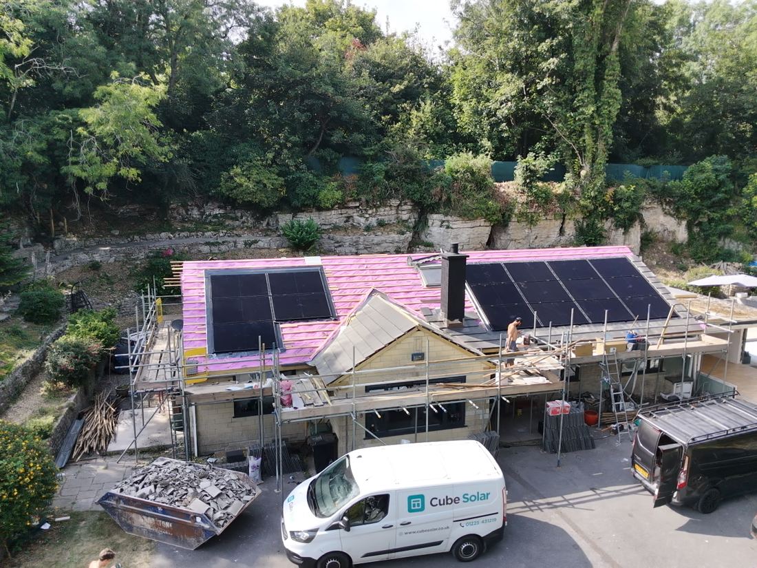 Cube Solar team re-roofing and installing solar panels and battery, with the branded Cube Solar van on site